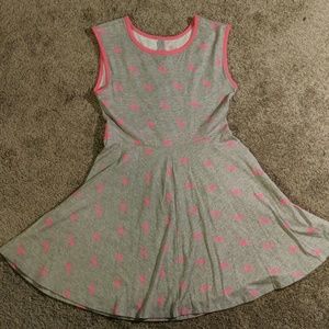A grey dress with a flamingo pattern